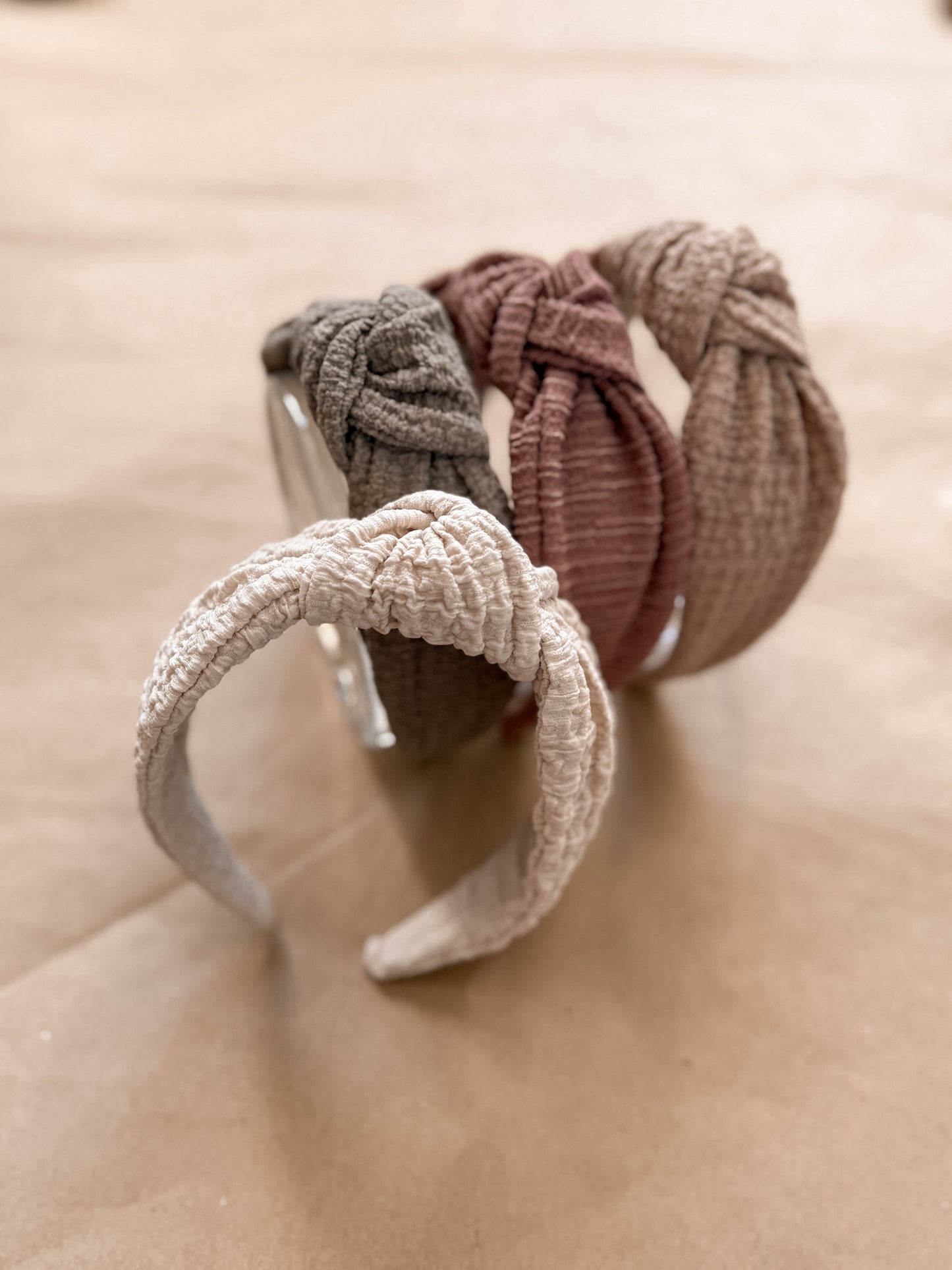 Textured top knot hard headband