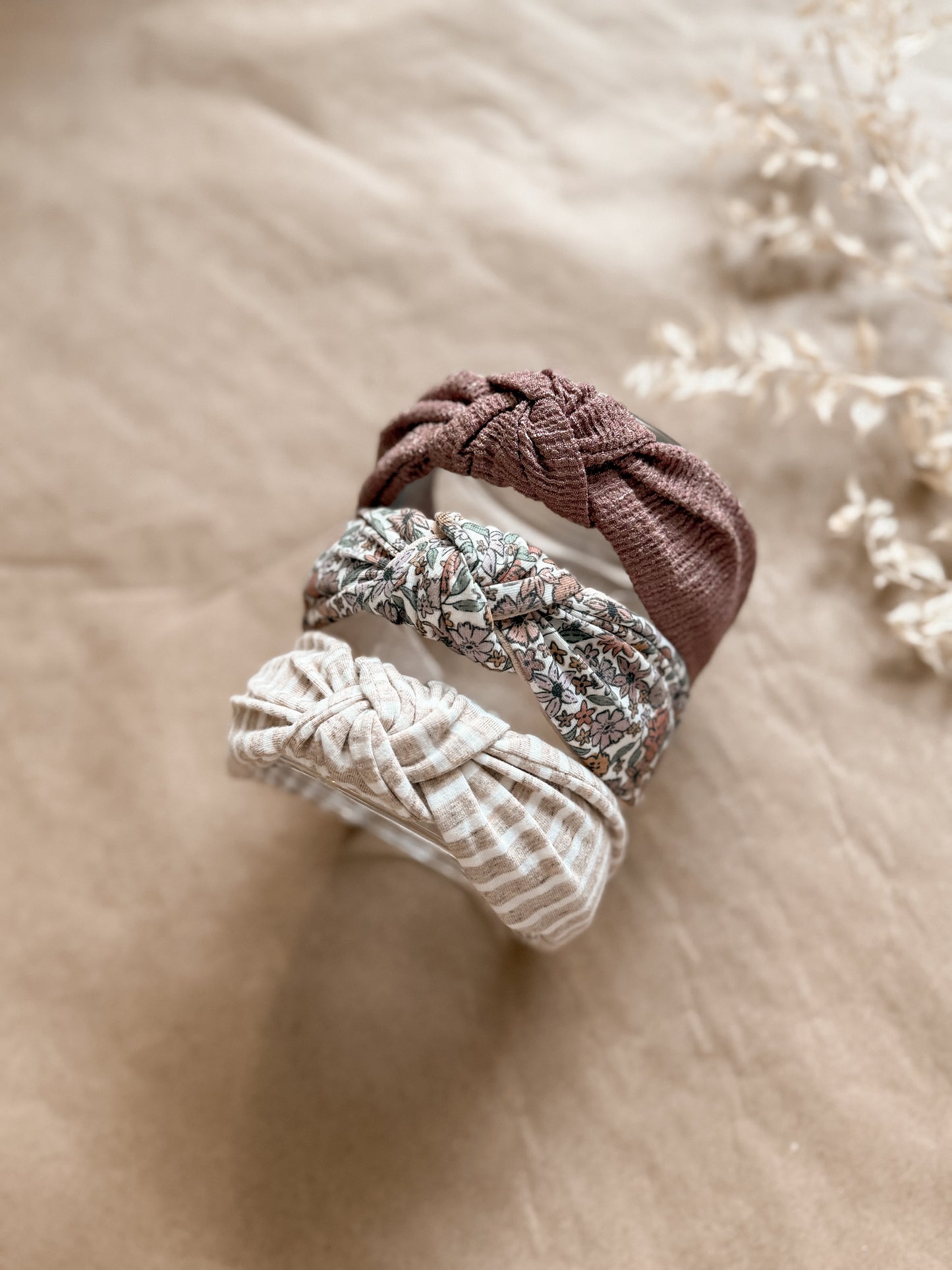 Floral top knot hard headband