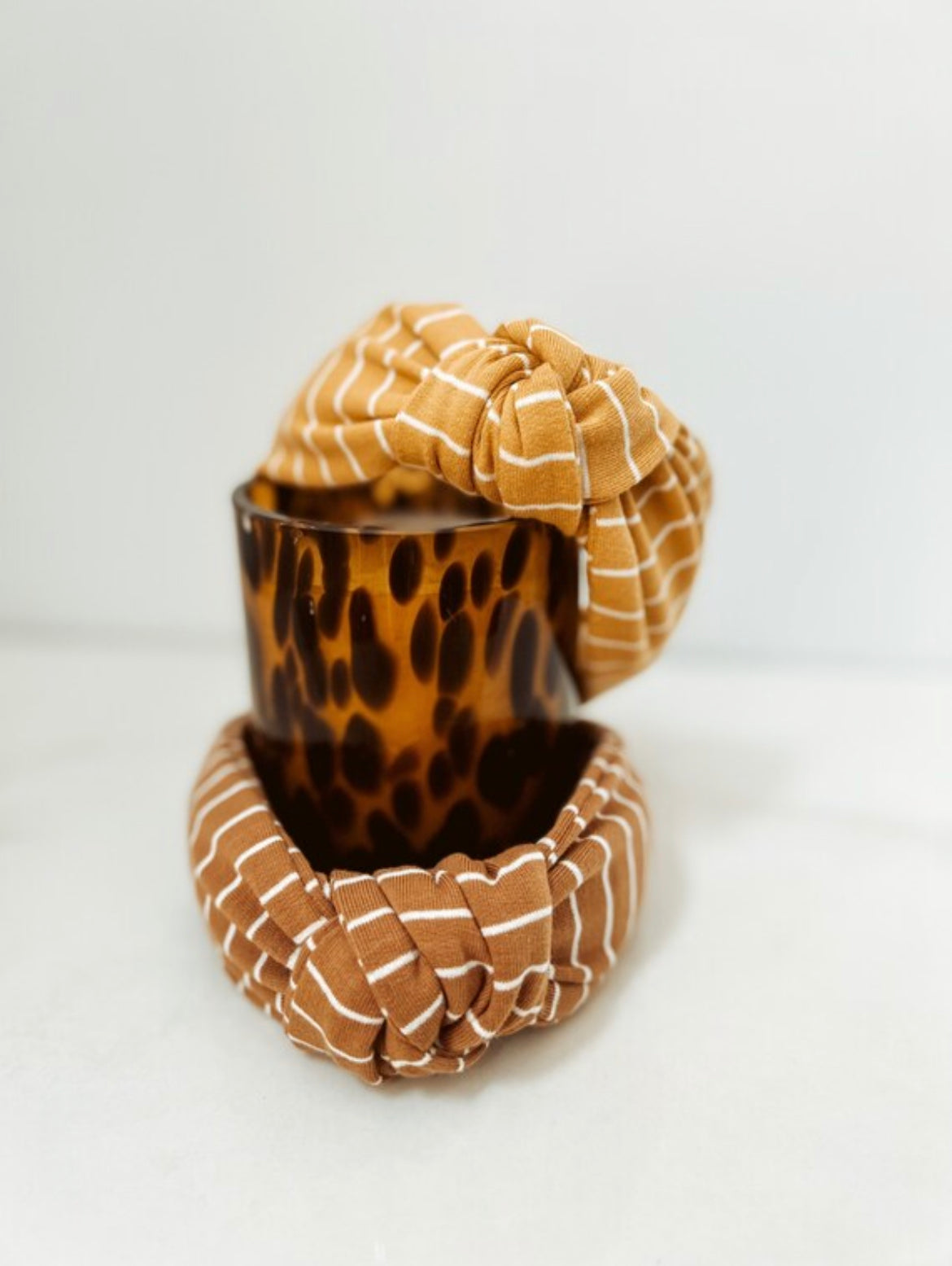 Stripe top knot hard headband