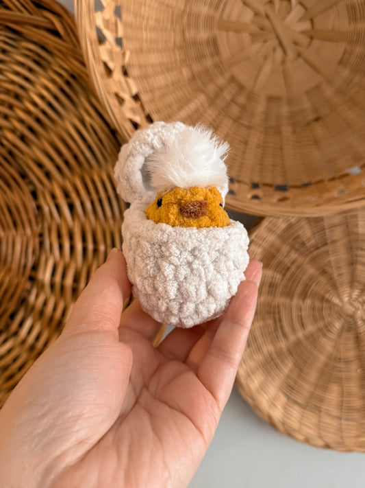 Chick in a hatched egg